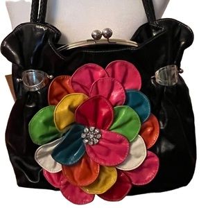 Very colorful very roomy gently used shoulder bag.